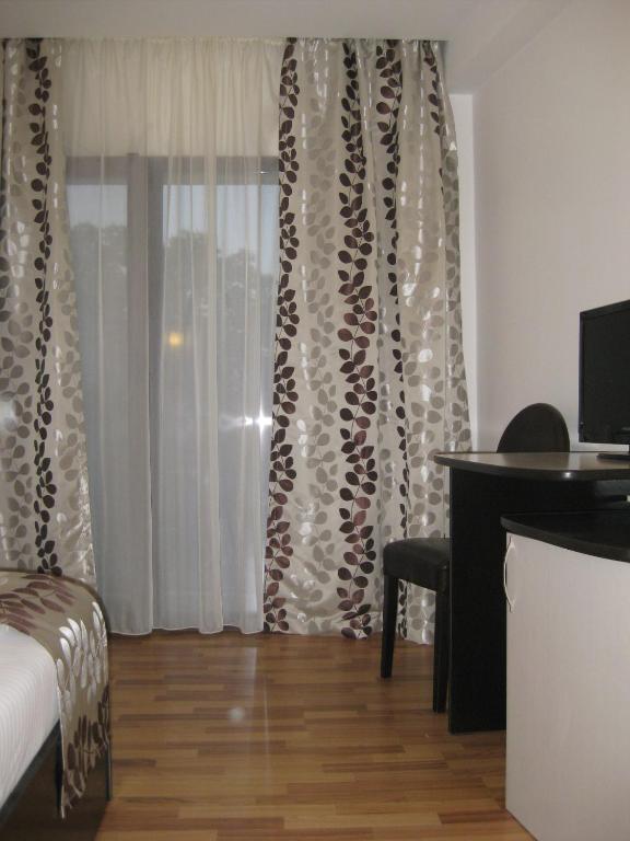 Postel nebo postele na pokoji v ubytování Hotel Anina