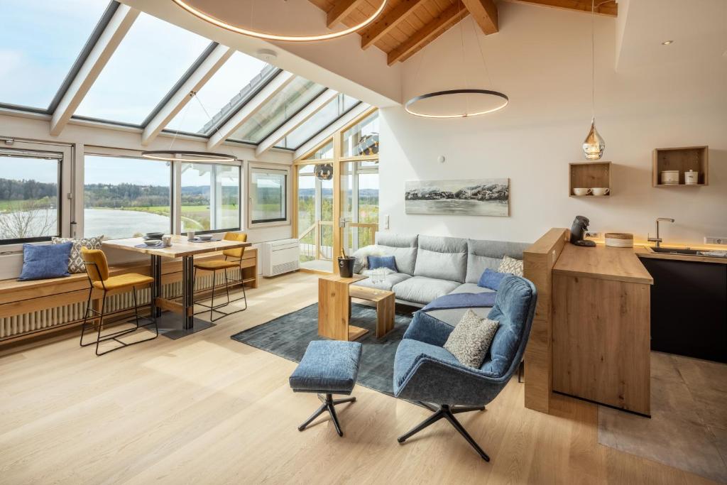 a kitchen and living room with a glass ceiling at Stille x Weite - Hochwertige Wohnung mit See-Panorama in Kronburg