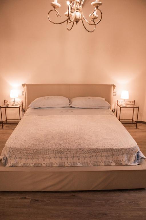 Postel nebo postele na pokoji v ubytování Fonte alle Ninfe B&B