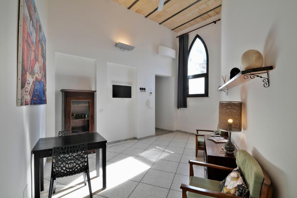 TV a/nebo společenská místnost v ubytování Palazzo Rollo