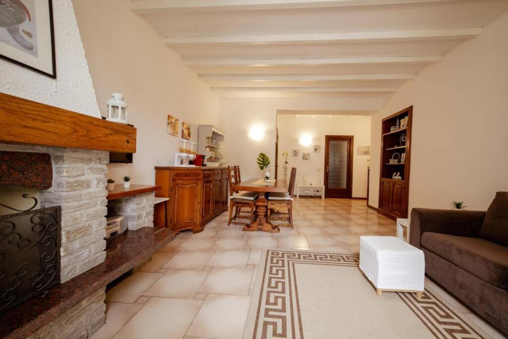 a living room with a couch and a fireplace at La finestra sul lago, appartamento in pieno centro in Laveno-Mombello