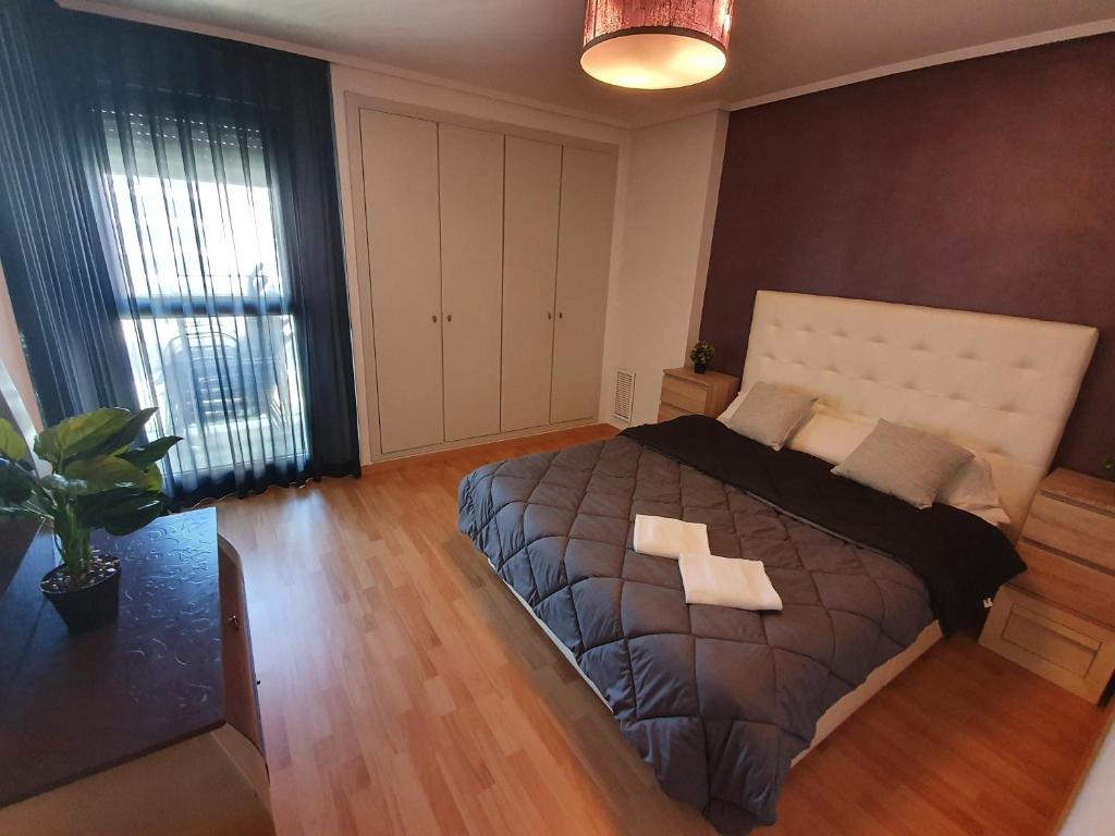 Postel nebo postele na pokoji v ubytování Style Apartment Patacona Beach segunda linea