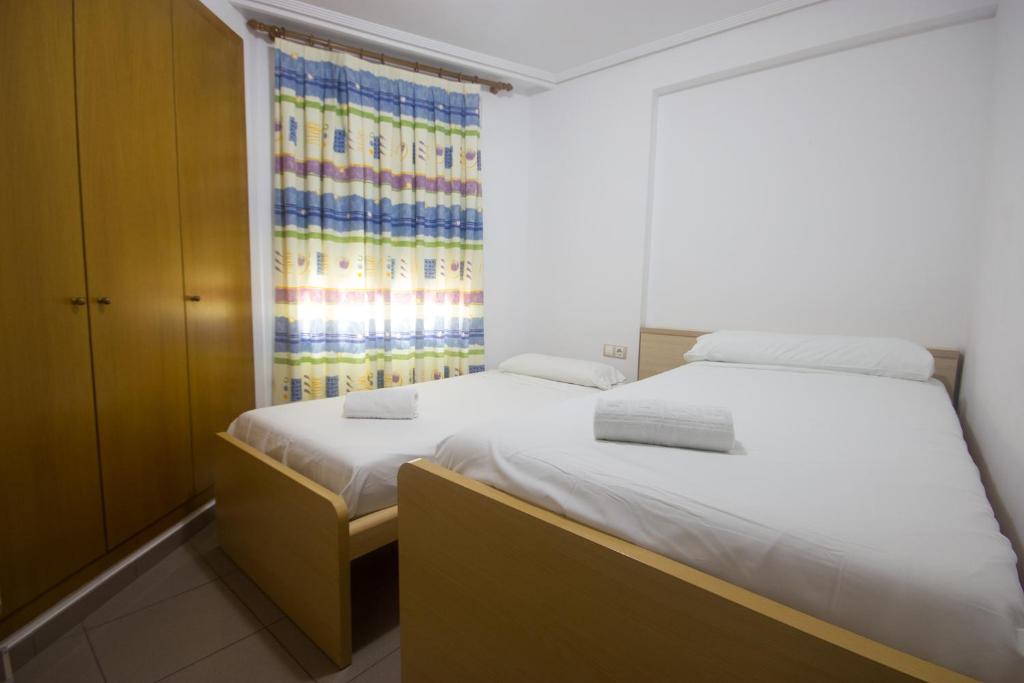Postel nebo postele na pokoji v ubytování Style Apartment Patacona Beach segunda linea