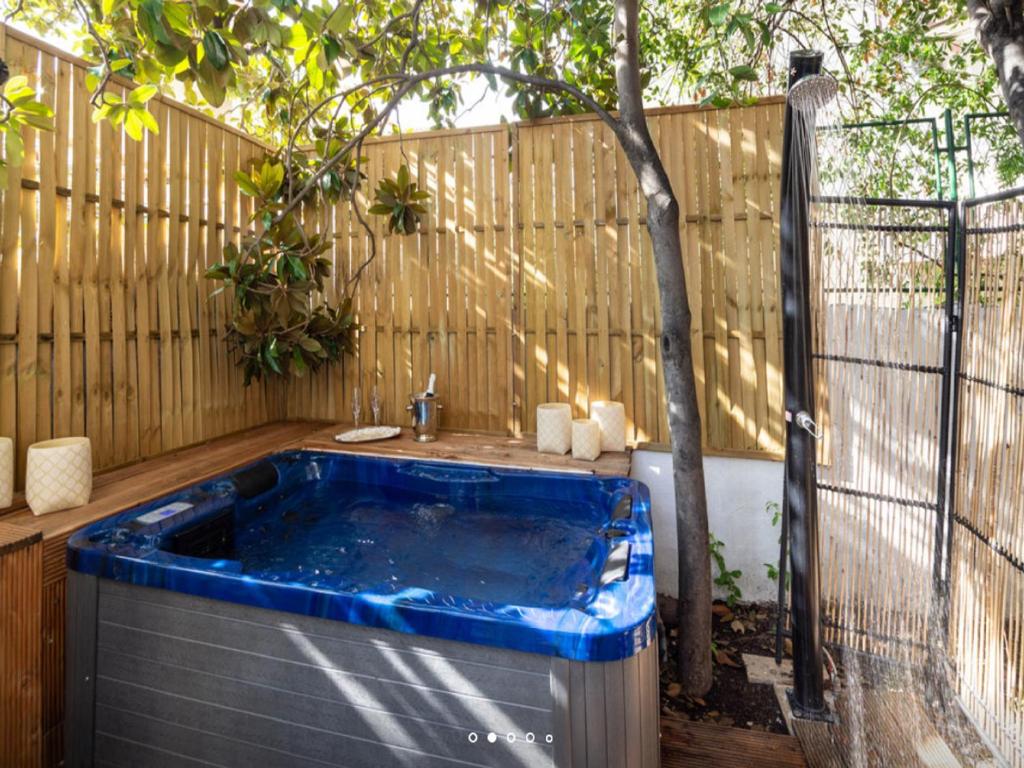 a hot tub in a backyard with a fence at Luxury Suite Jasmin in Split
