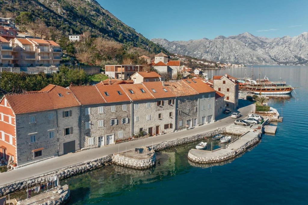 an aerial view of a town on the water at 18th Century Villa in the UNESCO Bay of Kotor in Kotor