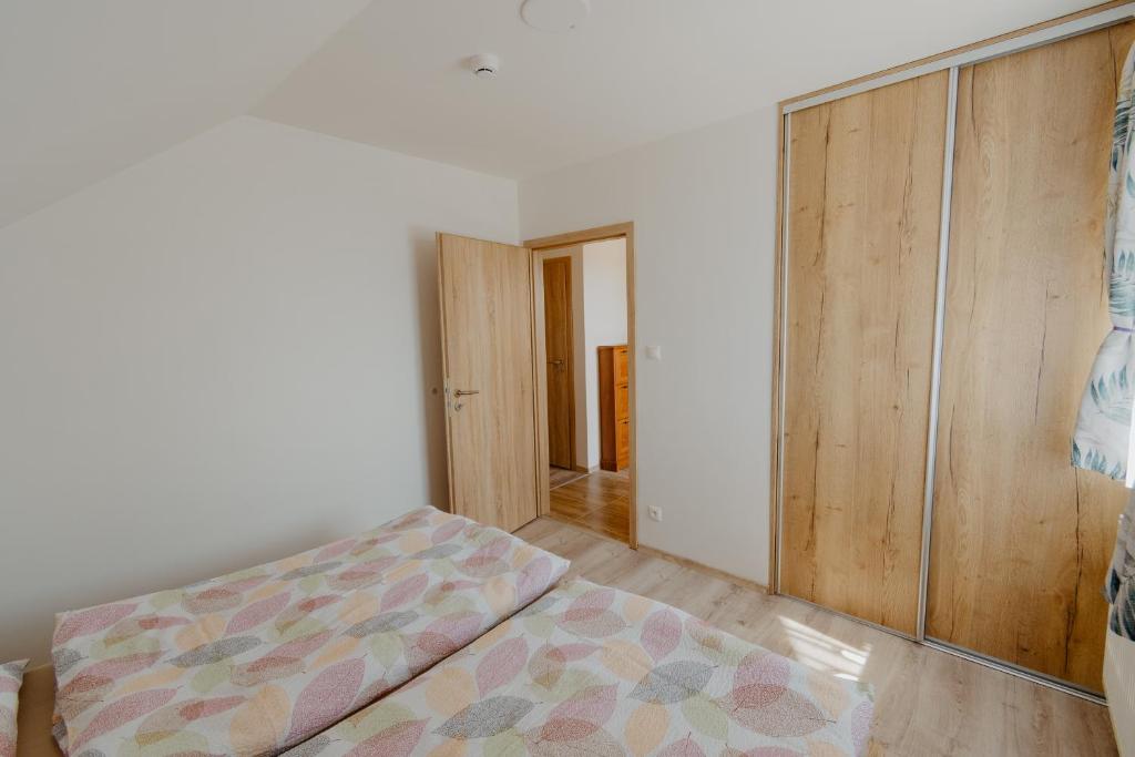 Postel nebo postele na pokoji v ubytování Apartmány Zara
