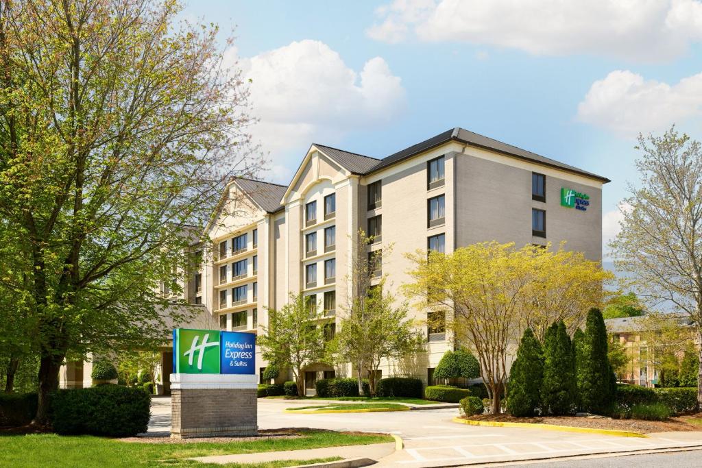 a building with a sign in front of it at Holiday Inn Express & Suites Alpharetta - Windward Parkway by IHG in Alpharetta