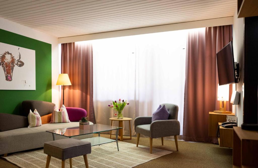 TV a/nebo společenská místnost v ubytování Haus Leithner - Suiten & Apartments