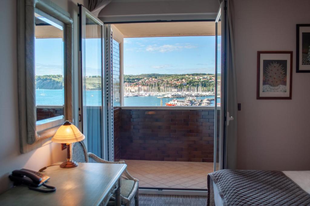 a hotel room with a view of the ocean at Hotel Marina in Izola