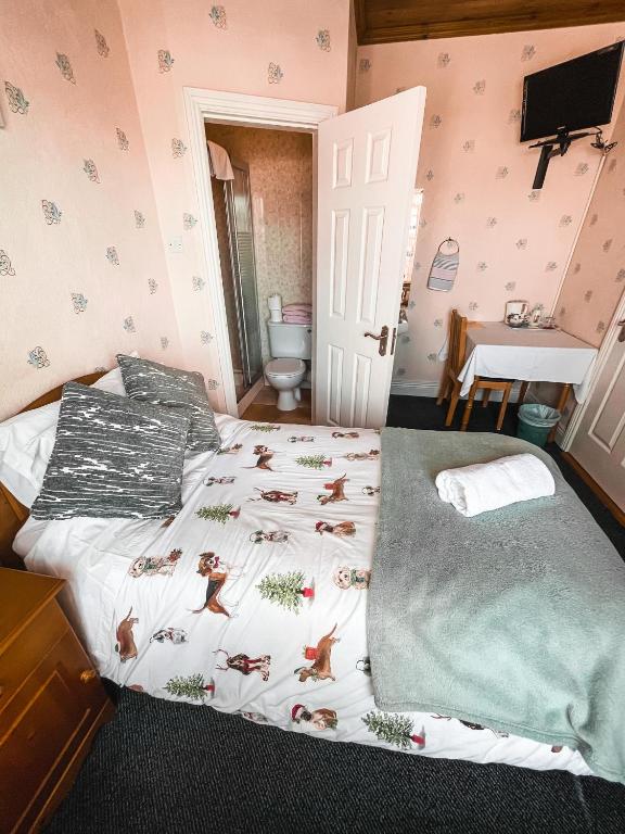 Postel nebo postele na pokoji v ubytování St Anthonys B&B