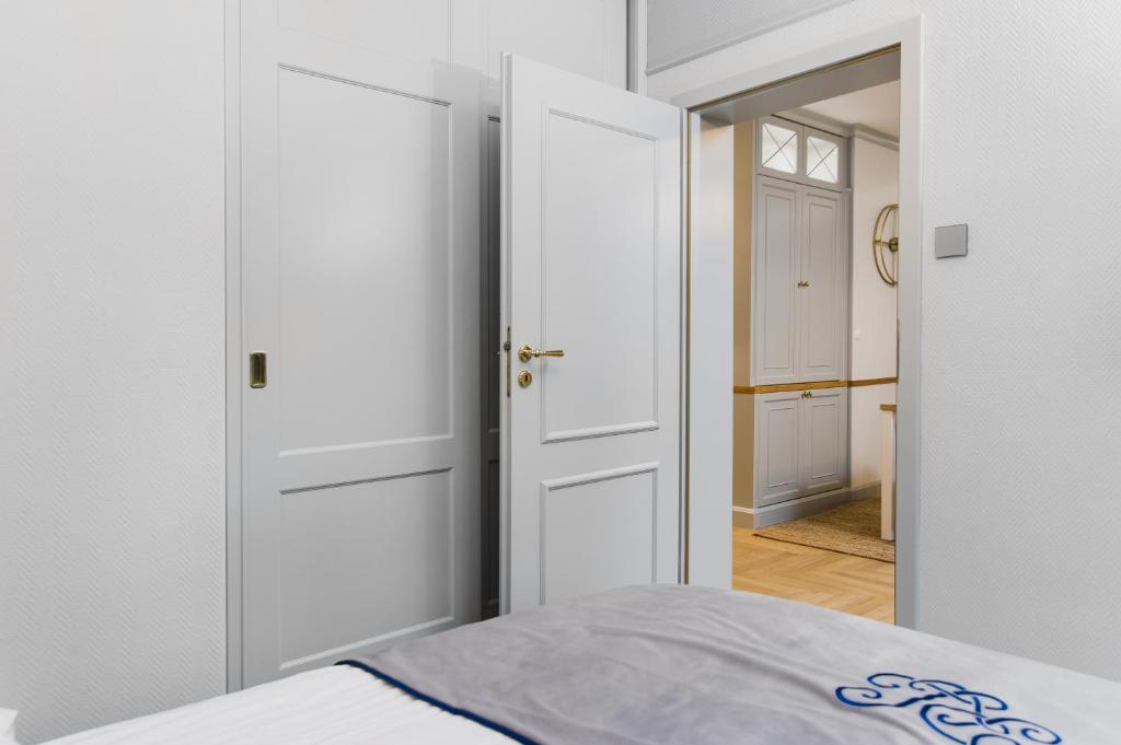 Posteľ alebo postele v izbe v ubytovaní Apartament ,,Cesarski Dwór”