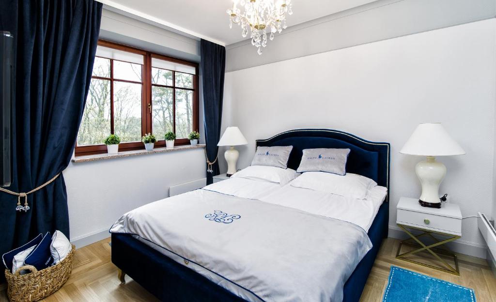 Posteľ alebo postele v izbe v ubytovaní Apartament ,,Cesarski Dwór”