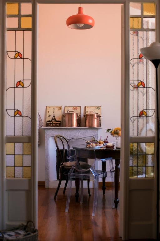 a dining room with a table and some chairs at B&B Agapantus in una Villa dell'800 in Dolceacqua