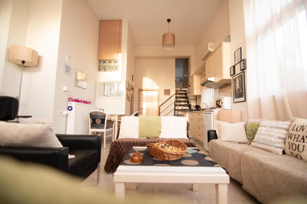 a living room with a couch and a table at Emily's House in Kos Town