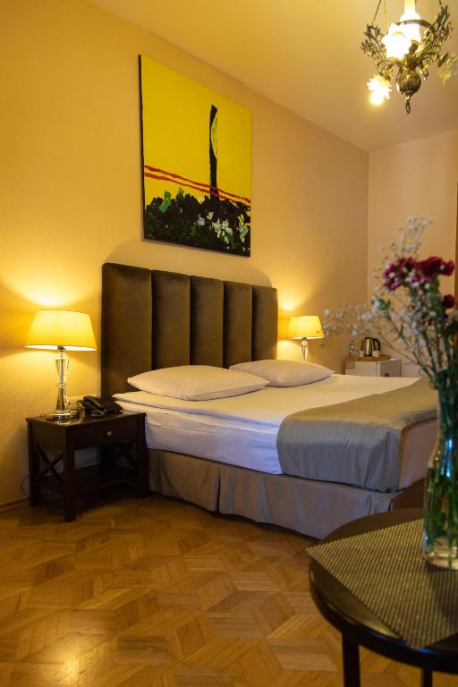 Postel nebo postele na pokoji v ubytování Hotel VIP