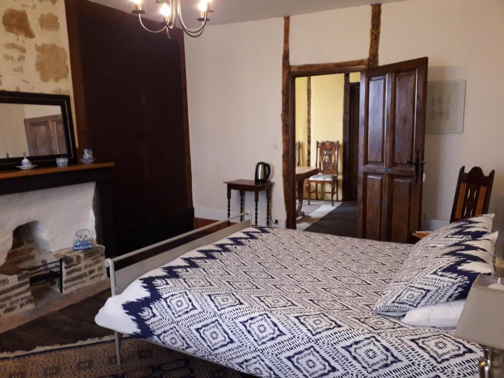 Postel nebo postele na pokoji v ubytování DUC MANOIR Chambres d'hôtes