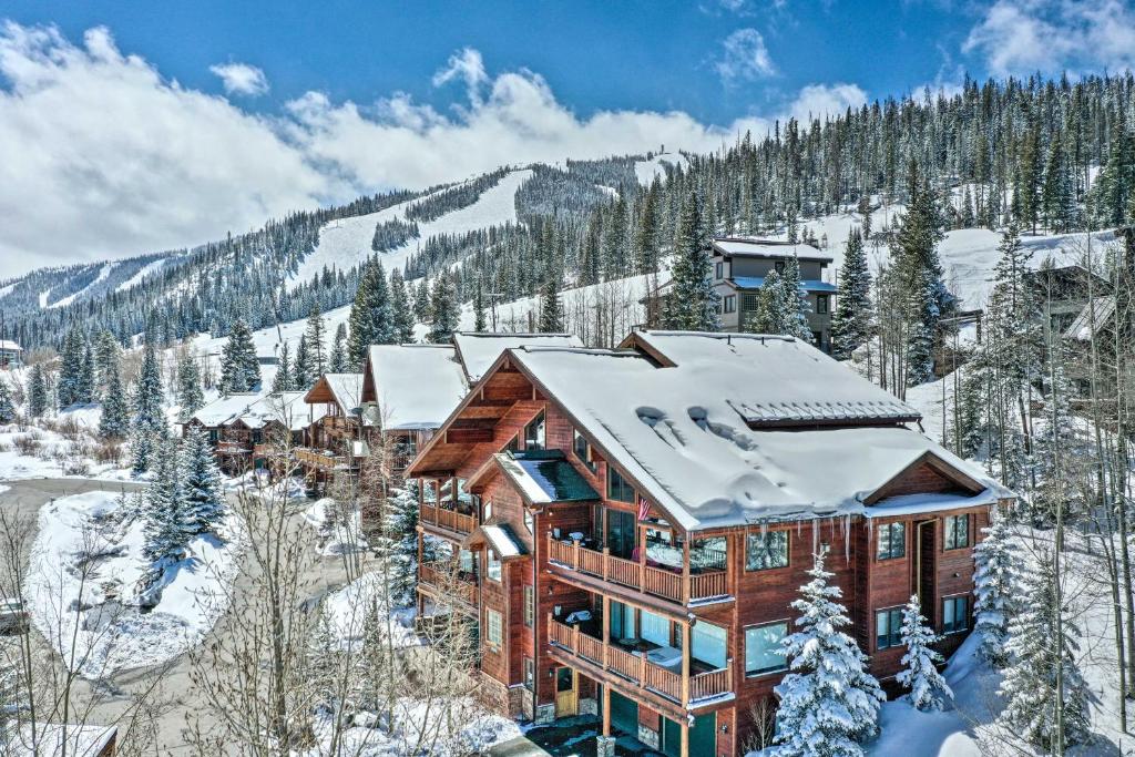 a lodge in the snow with snow covered trees at Slopeside Sanctuary - Penthouse Less Than 1 Mi to Lifts! in Winter Park