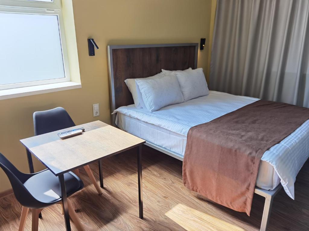 Postel nebo postele na pokoji v ubytování STARK HOTEL