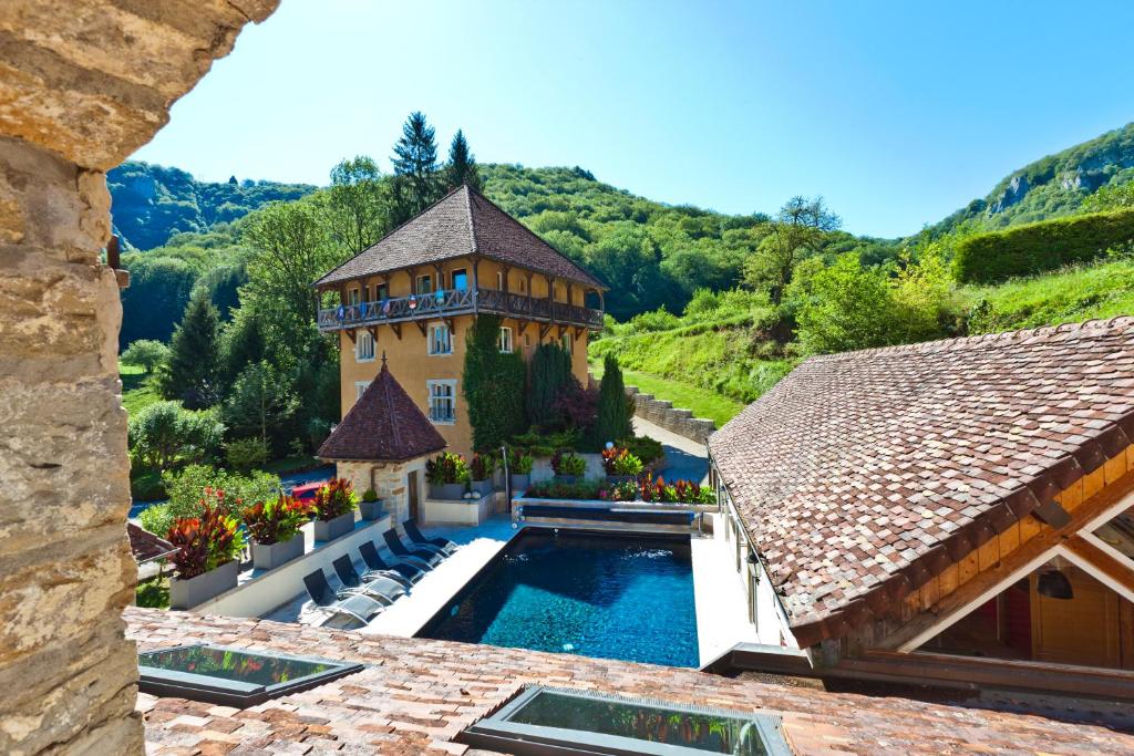 an aerial view of a house with a swimming pool at Castel Damandre in Arbois