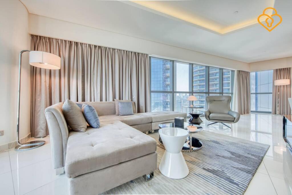 a living room with a couch and a table at Keysplease 5* 2 B/R Apt, Damac Paramount Residence in Dubai