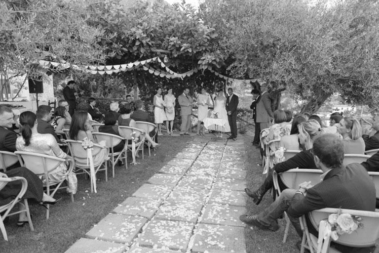 a black and white photo of a wedding ceremony at Villa Borgo San Michele in Amalfi