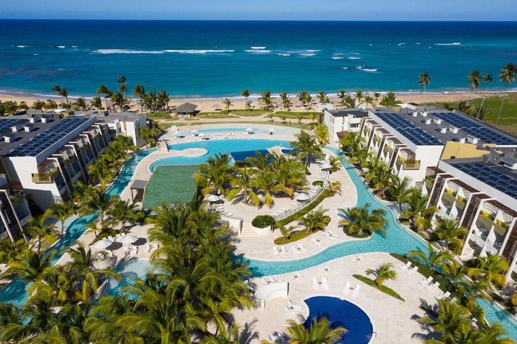 an aerial view of a resort with a pool and the ocean at Dreams Onyx Resort & Spa - All Inclusive in Punta Cana