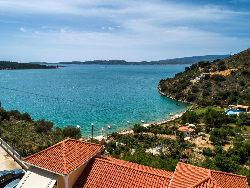 a view of the ocean from a house at SEA VIEW RETREAT STUDIO IN AGIOS KONSTANTINOS! in Dhavgáta