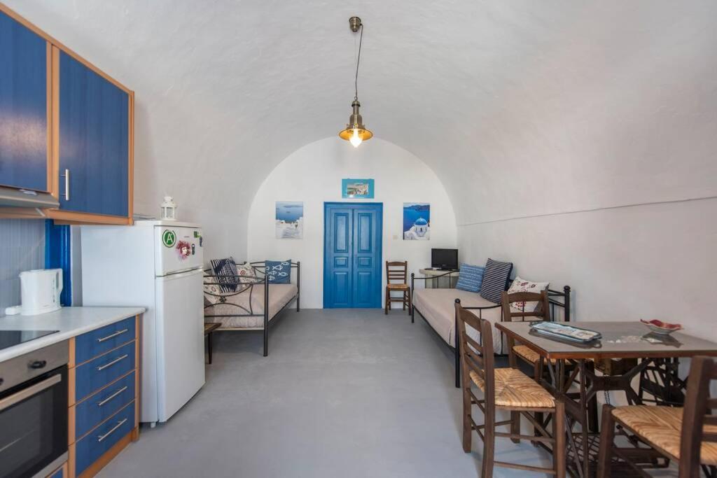 a kitchen with a living room and a dining room at Eva's Guesthouse in Éxo Goniá