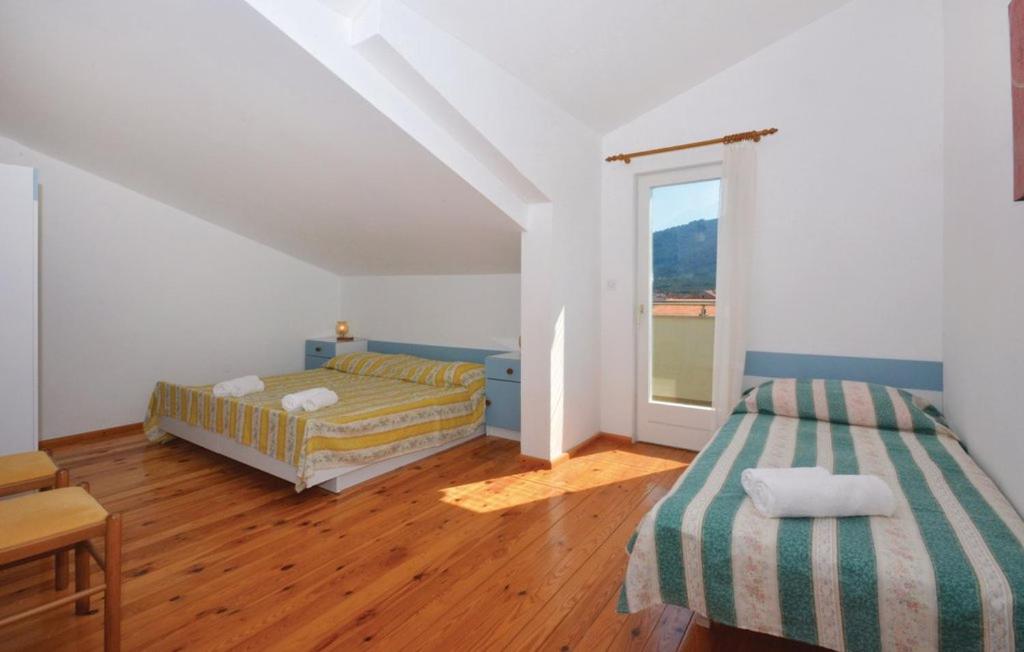 Postel nebo postele na pokoji v ubytování Apartman Tudor