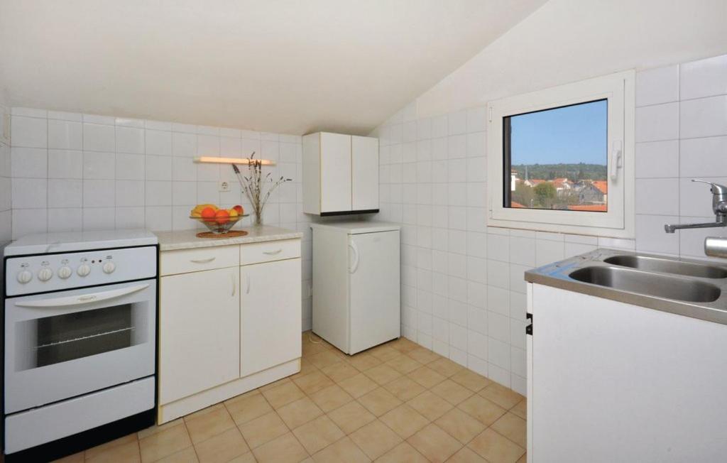 Kuchyň nebo kuchyňský kout v ubytování Apartman Tudor