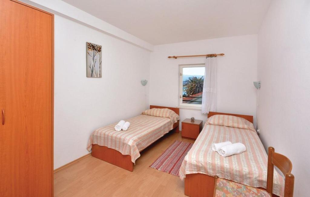 Postel nebo postele na pokoji v ubytování Apartman Tudor