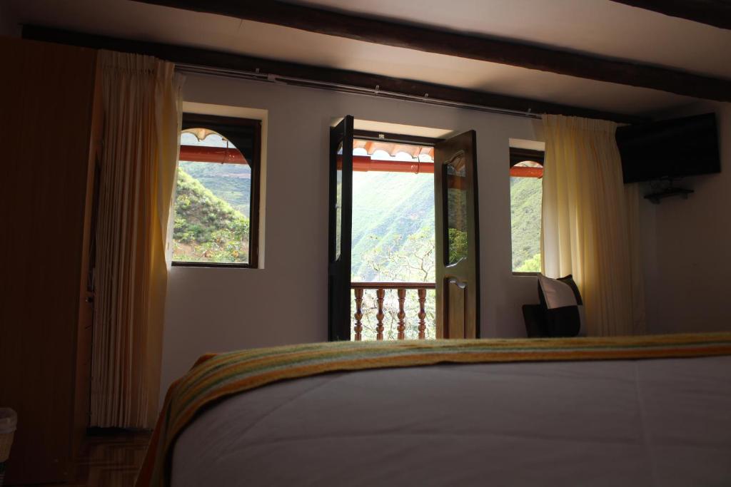 Postel nebo postele na pokoji v ubytování Utcubamba River Lodge