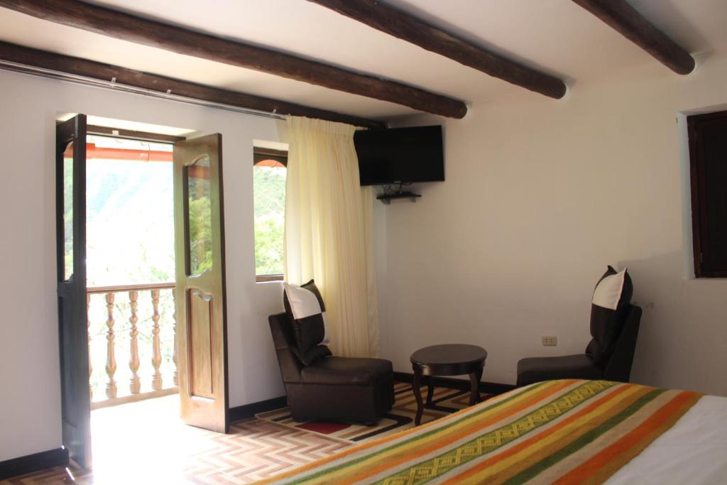 Postel nebo postele na pokoji v ubytování Utcubamba River Lodge