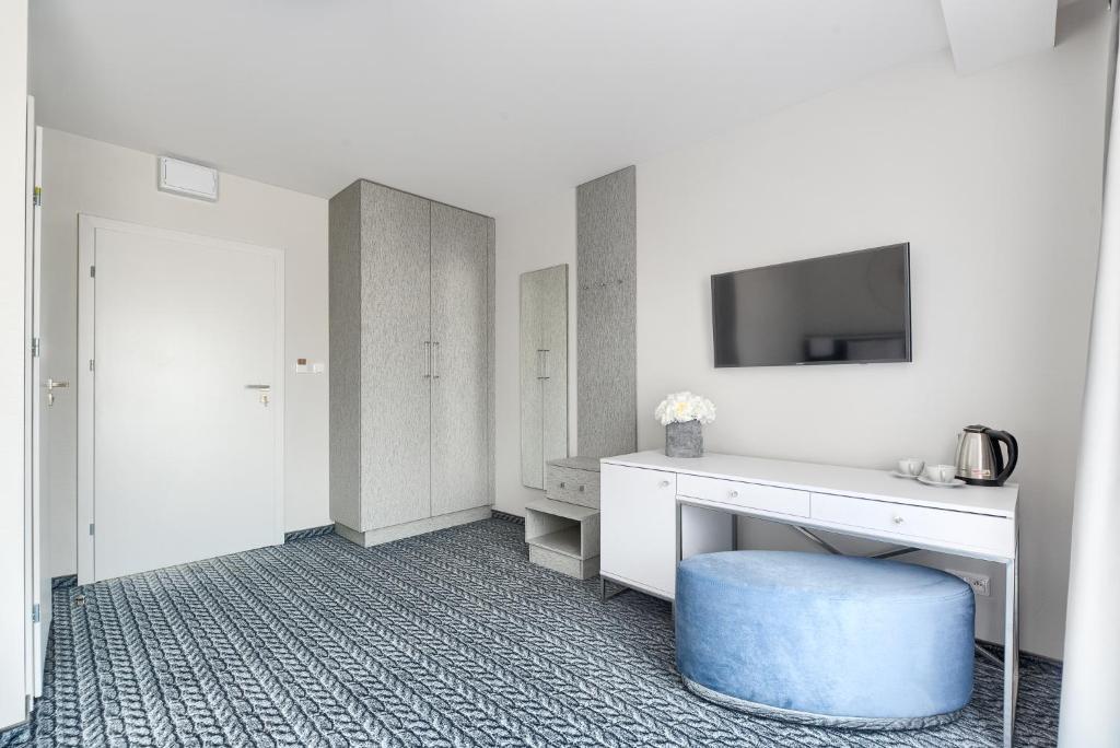 TV a/nebo společenská místnost v ubytování Szymański Holiday Rooms