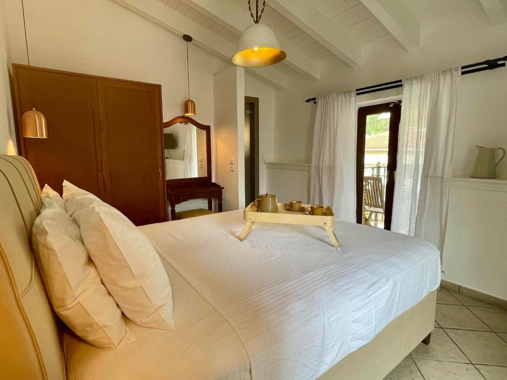 Postel nebo postele na pokoji v ubytování Hotel Acropol