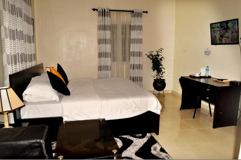 Postel nebo postele na pokoji v ubytování J Gibson Hotel