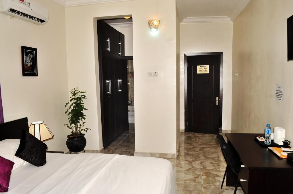 Postel nebo postele na pokoji v ubytování J Gibson Hotel
