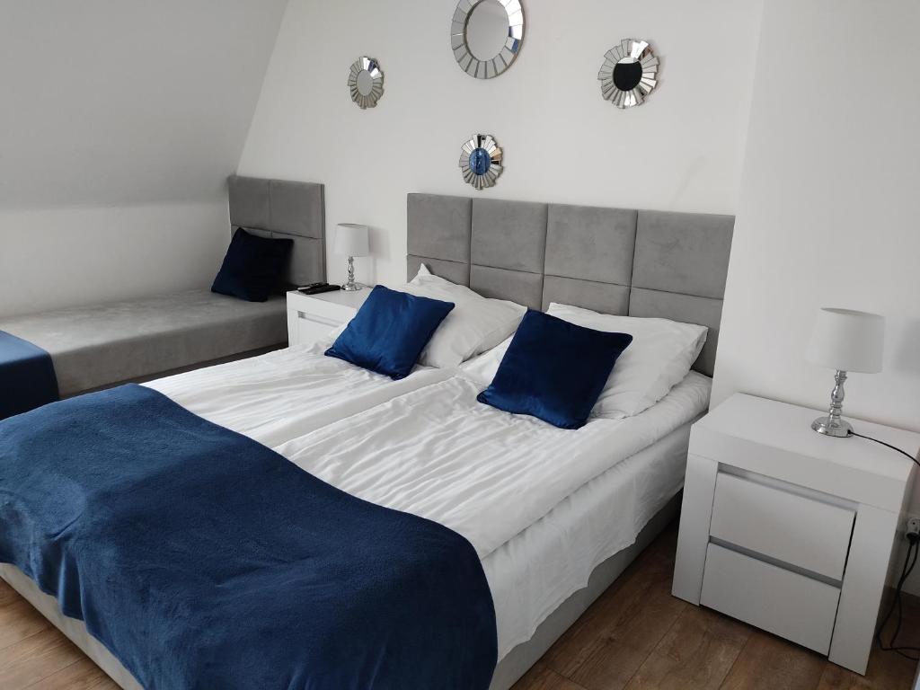Postel nebo postele na pokoji v ubytování Gracja Dom przy Plaży