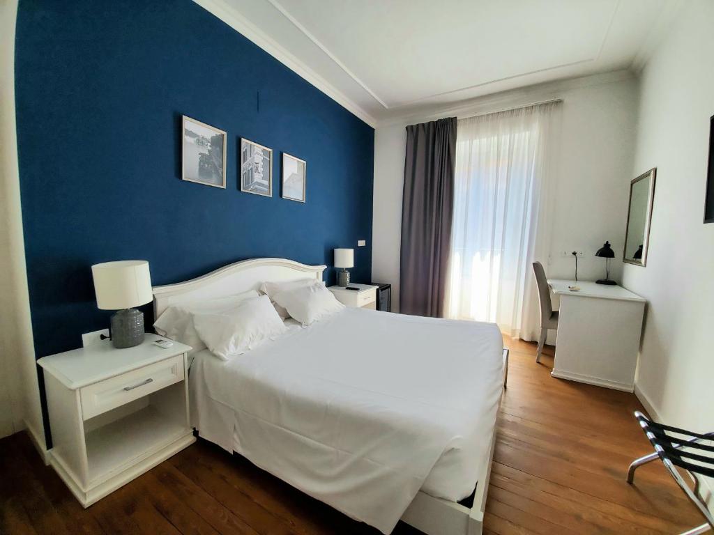 Posteľ alebo postele v izbe v ubytovaní More Cola di Rienzo B&B