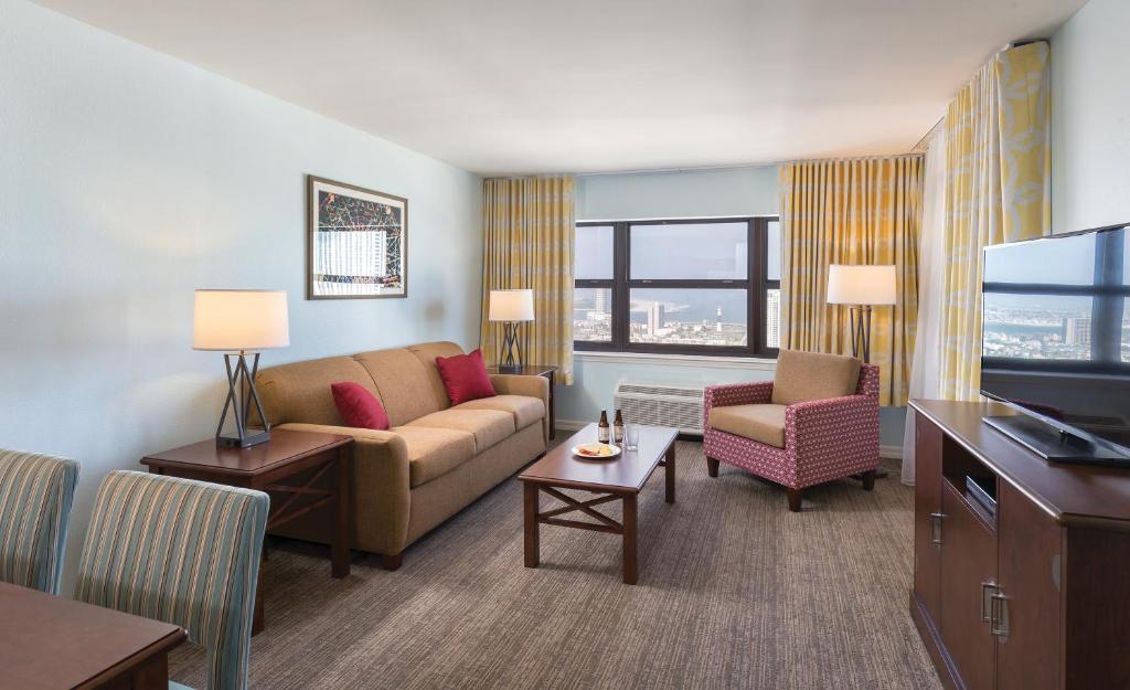 a living room filled with furniture and a couch at Club Wyndham Skyline Tower in Atlantic City