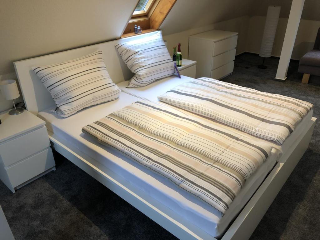 Postel nebo postele na pokoji v ubytování Stadtoase