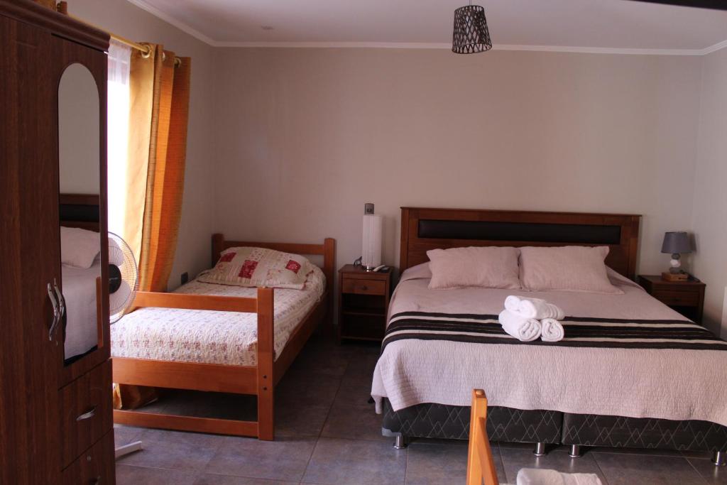 Postel nebo postele na pokoji v ubytování Vicuña Lodge