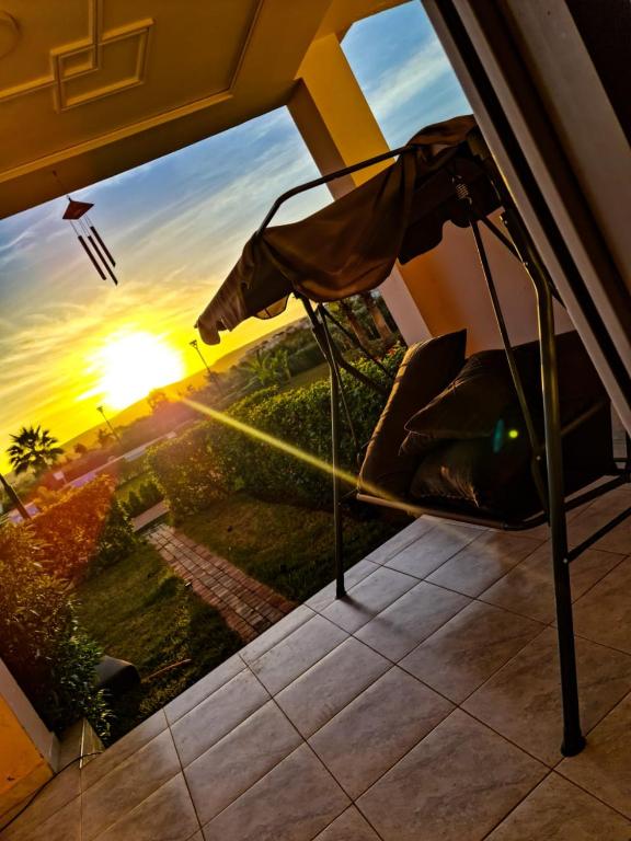 a view of the sunset from a window of a house at FamilyConfort Saidia in Saïdia