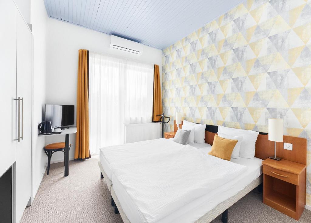 Postel nebo postele na pokoji v ubytování Lorelei Pension Adults Only