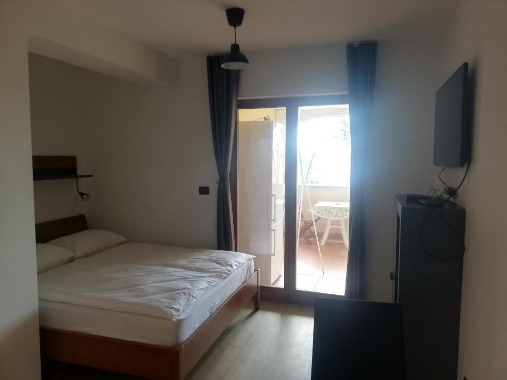 Postel nebo postele na pokoji v ubytování Apartment Rustica