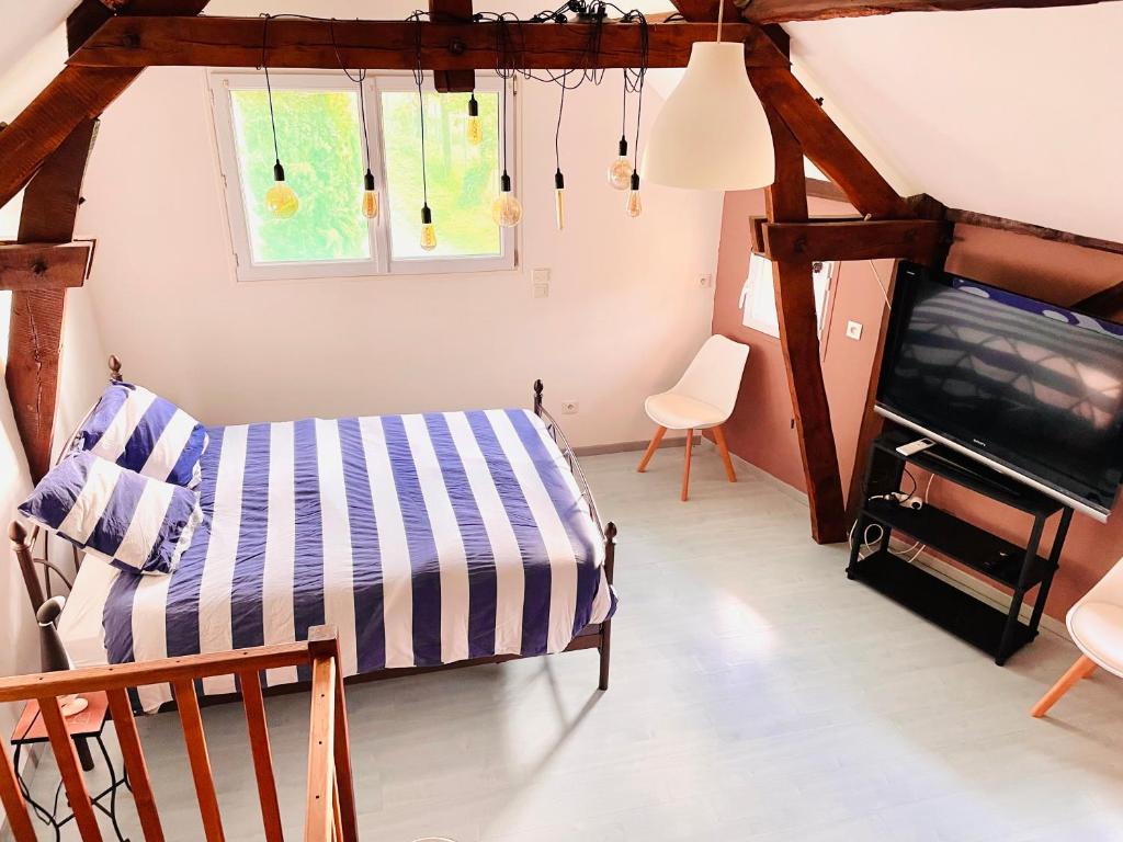 Postel nebo postele na pokoji v ubytování Gîte de la Vernière