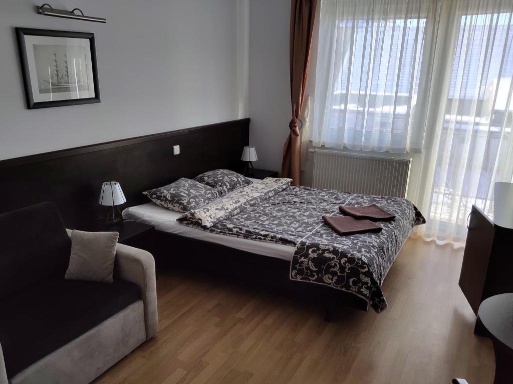 Postel nebo postele na pokoji v ubytování Willa Latarnik - doskonała lokalizacja, blisko atrakcji, 20min do plaży