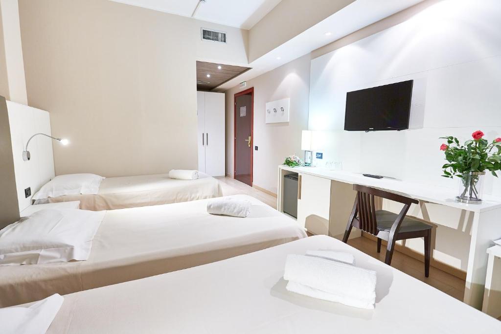 Łóżko lub łóżka w pokoju w obiekcie Ferretti MajesticHouse