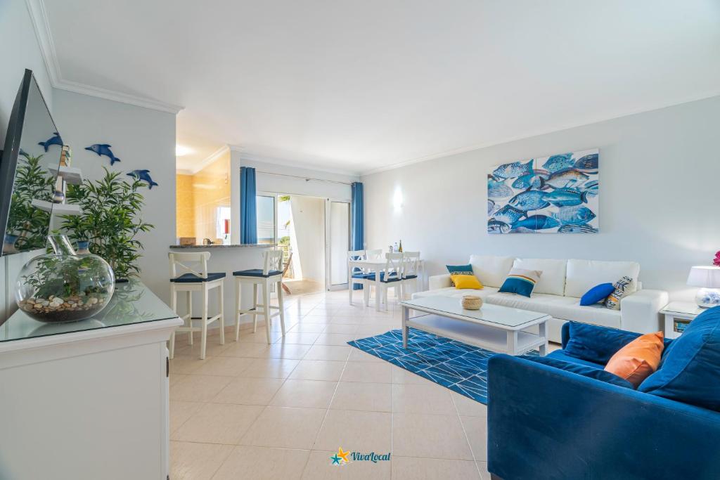 TV a/nebo společenská místnost v ubytování Vila da Praia - Apartamento Viva Local