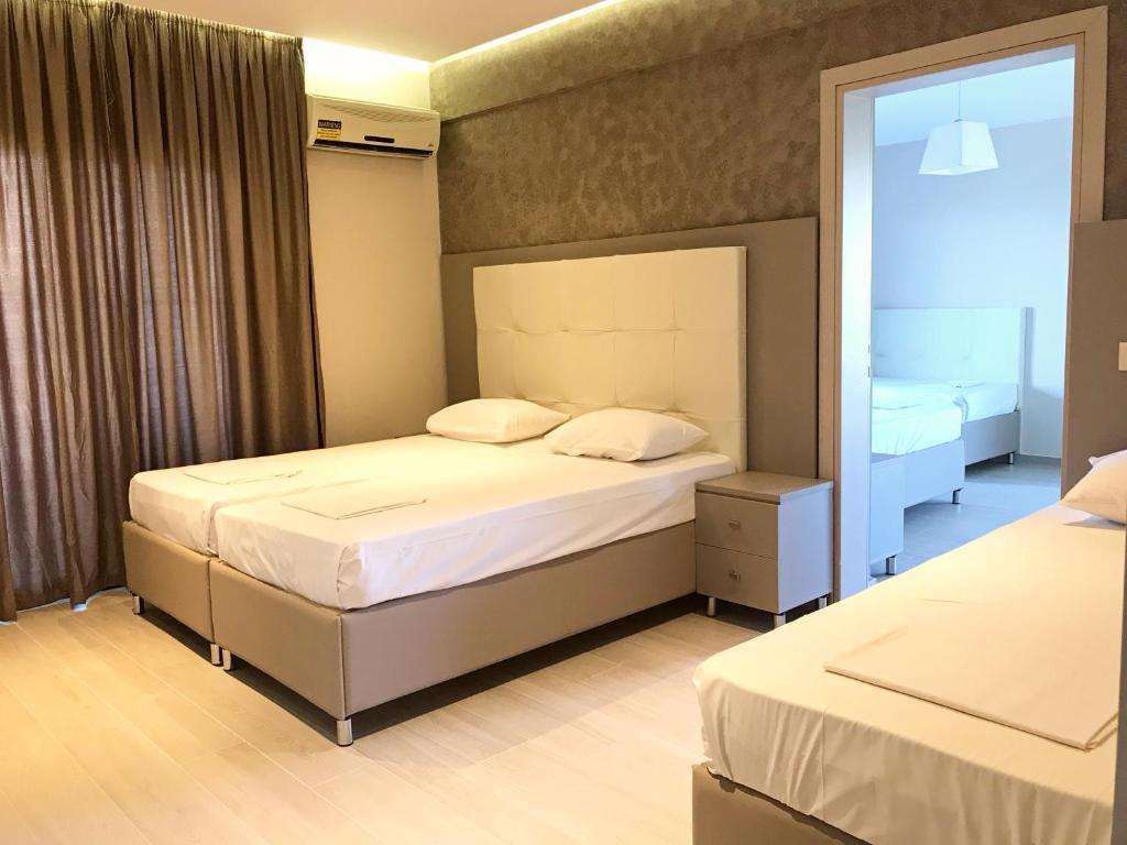 Posteľ alebo postele v izbe v ubytovaní Villa Diamantis Apartments